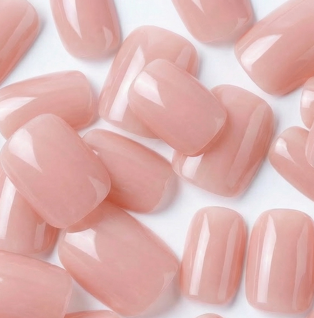 Pink press-on nails in everyday wear